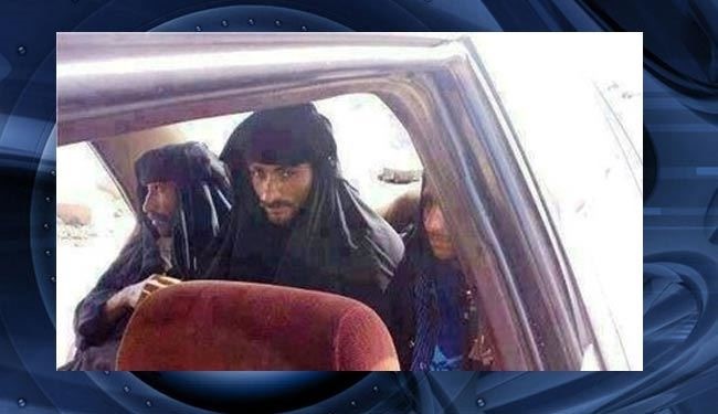 عکس خبري -سرکرده داعش که با لباس زنانه به دام افتاد