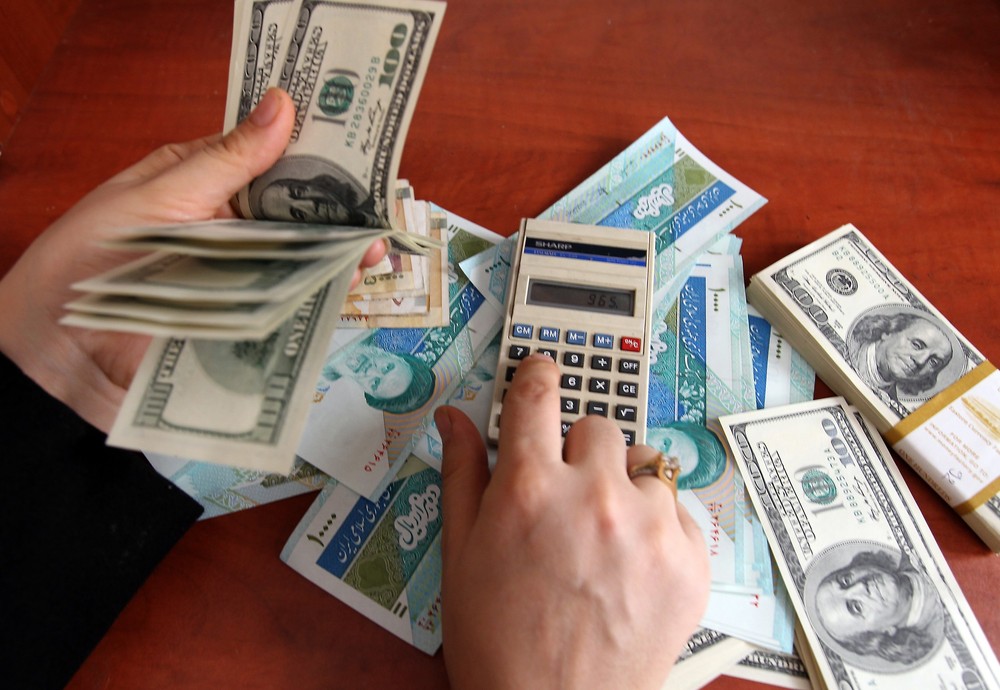 عکس خبري -حذف دلار از مبادلات تجاري نسخه شفابخش اقتصاد ايران