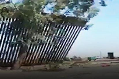 عکس خبري - ديوار مرزي ترامپ با وزش باد تخريب شد! + ويدئو
