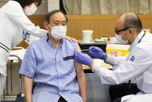 عکس خبري -نخست وزير ژاپن براي ديدار با بايدن واکسن کرونا زد